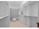 Expansive walk-in closet with custom shelving and ample storage space at 9821 Caroline Park Dr, Orlando, FL 32832