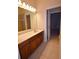 Bathroom showing a large vanity and sink with a view of the shower behind the mirror at 13157 Paloma Dr, Orlando, FL 32837