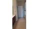 Bathroom with tile flooring, vanity with brown cabinets, white door, and natural light at 13157 Paloma Dr, Orlando, FL 32837