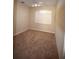 Bedroom featuring neutral carpet, window with shutter, and natural light at 13157 Paloma Dr, Orlando, FL 32837