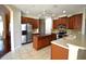 Well-equipped kitchen features stainless steel appliances, dark wood cabinetry, and a center island at 13157 Paloma Dr, Orlando, FL 32837