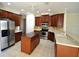 Well-equipped kitchen features stainless steel appliances, dark wood cabinetry, and a center island at 13157 Paloma Dr, Orlando, FL 32837