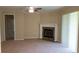 The carpeted living room has a fireplace and sliding doors at 13157 Paloma Dr, Orlando, FL 32837