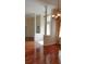 Spacious living room featuring gleaming hardwood floors, elegant columns, and natural light at 13157 Paloma Dr, Orlando, FL 32837