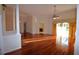 Bright and spacious living room featuring hardwood floors, elegant columns, and large sliding glass doors at 13157 Paloma Dr, Orlando, FL 32837