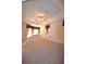Large primary bedroom featuring tray ceiling, fan, and windows with decorative curtains at 13157 Paloma Dr, Orlando, FL 32837