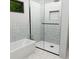 Modern bathroom featuring a soaking tub, glass-enclosed shower, and stylish fixtures at Tbd Sw 177Th St, Ocala, FL 34473