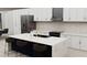Contemporary kitchen featuring a large island, modern appliances, and white cabinetry at Tbd Sw 177Th St, Ocala, FL 34473