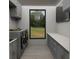 Bright laundry room boasting generous cabinetry, modern appliances, and window view of grassy yard at Tbd Sw 177Th St, Ocala, FL 34473