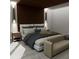 Comfortable main bedroom with a king-size bed, neutral color palette, and wood paneling at Tbd Sw 177Th St, Ocala, FL 34473