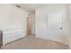 A bedroom featuring a white dresser, neutral color palette, and comfortable carpet at 1010 Morvan Ln, Kissimmee, FL 34759