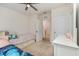 This bedroom features carpet floors, ceiling fan, dresser and two beds at 1010 Morvan Ln, Kissimmee, FL 34759