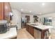 Bright kitchen featuring modern appliances, spacious countertops, and an adjacent dining area at 1010 Morvan Ln, Kissimmee, FL 34759