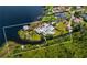 Stunning aerial view of the property, showcasing its waterfront location and lush surroundings at 10300 Pocket Ln, Orlando, FL 32836