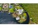 Stunning aerial view of the waterfront estate, showcasing lush landscaping, a dock, and lake access at 10300 Pocket Ln, Orlando, FL 32836