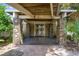 Elegant entrance featuring stone pillars and a covered walkway at 10300 Pocket Ln, Orlando, FL 32836