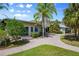 Charming home exterior with a paver driveway and mature landscaping at 10300 Pocket Ln, Orlando, FL 32836