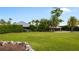 Well-maintained front yard with lush green grass and mature trees at 10300 Pocket Ln, Orlando, FL 32836