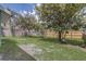 Large backyard with green grass and well maintained wooden fence at 10599 Satinwood Cir, Orlando, FL 32825