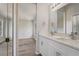 Bathroom featuring dual sinks and attached room with a bath tub and shower at 10599 Satinwood Cir, Orlando, FL 32825