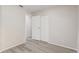Bedroom featuring a closet and wood-look floors at 10599 Satinwood Cir, Orlando, FL 32825