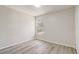 Bright bedroom with hardwood flooring and window with views of the property grounds at 10599 Satinwood Cir, Orlando, FL 32825