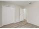 Spacious bedroom with closet and attached room with an open doorway at 10599 Satinwood Cir, Orlando, FL 32825