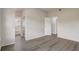 Open concept living room featuring hard surface floors and white colored walls at 10599 Satinwood Cir, Orlando, FL 32825
