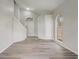 Bright, neutral living room featuring new flooring, modern arched windows, and a staircase at 10599 Satinwood Cir, Orlando, FL 32825