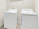 This laundry room offers a full-size washer and dryer at 11139 Cyrilla Woods Dr, Orlando, FL 32832