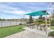Outdoor picnic area featuring shaded tables, BBQ grill, and scenic lake views, perfect for community gatherings at 11139 Cyrilla Woods Dr, Orlando, FL 32832