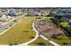 Aerial view of a modern playground and park in a residential neighborhood, offering a safe space for to play at 11139 Cyrilla Woods Dr, Orlando, FL 32832