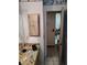 Bathroom with a wood vanity and a mirror above the sink at 1152 Ring St, Deltona, FL 32725