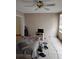 Bedroom with tiled floors, fan, and a window at 1152 Ring St, Deltona, FL 32725