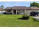 Charming single-story home with a well-maintained lawn, and a brick exterior at 1152 Ring St, Deltona, FL 32725