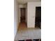 Hallway featuring tile flooring, neutral walls, and access to various rooms, creating a seamless flow throughout the home at 1152 Ring St, Deltona, FL 32725