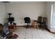 Living room with tiled floors, natural lighting, and minimal furnishing at 1152 Ring St, Deltona, FL 32725
