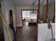 Living room featuring tiled floors, chandelier, and wooden railing at 1152 Ring St, Deltona, FL 32725