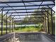 Pool needing maintenance featuring an caged enclosure with a large backyard, perfect for outdoor activities and relaxation at 1152 Ring St, Deltona, FL 32725