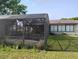 Caged pool needing maintenance, set against a backdrop of a well-maintained lawn and the home's exterior at 1152 Ring St, Deltona, FL 32725