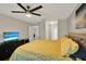 Spacious bedroom featuring a yellow bed, television, and a relaxing atmosphere at 1165 Indian Ridge E Trl, Kissimmee, FL 34747