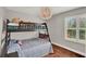 Bedroom with a bunk bed, natural light, and a cozy ambiance for restful nights at 1165 Indian Ridge E Trl, Kissimmee, FL 34747