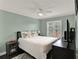 Bedroom with a comfortable bed, window, and a calming atmosphere at 1165 Indian Ridge E Trl, Kissimmee, FL 34747
