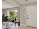 Bright foyer with tile flooring and a view of the landscaped yard at 1165 Indian Ridge E Trl, Kissimmee, FL 34747