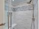 Bathroom shower features a shower head and glass door at 1165 Indian Ridge E Trl, Kissimmee, FL 34747