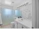 Bright bathroom boasts sleek fixtures, a large mirror, and a glass-enclosed shower at 126 Spanish Moss Ct, Orlando, FL 32828