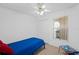 Bright bedroom featuring a ceiling fan, closet, and window for natural light at 126 Spanish Moss Ct, Orlando, FL 32828