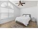 Inviting bedroom features a comfortable bed, ample light, and cozy carpet at 126 Spanish Moss Ct, Orlando, FL 32828
