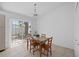 Eat-in kitchen boasts natural light, dining table, and access to the outdoors at 126 Spanish Moss Ct, Orlando, FL 32828