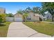 Attractive single-story home showcasing a well-kept lawn, one-car garage, and pleasant landscaping at 126 Spanish Moss Ct, Orlando, FL 32828